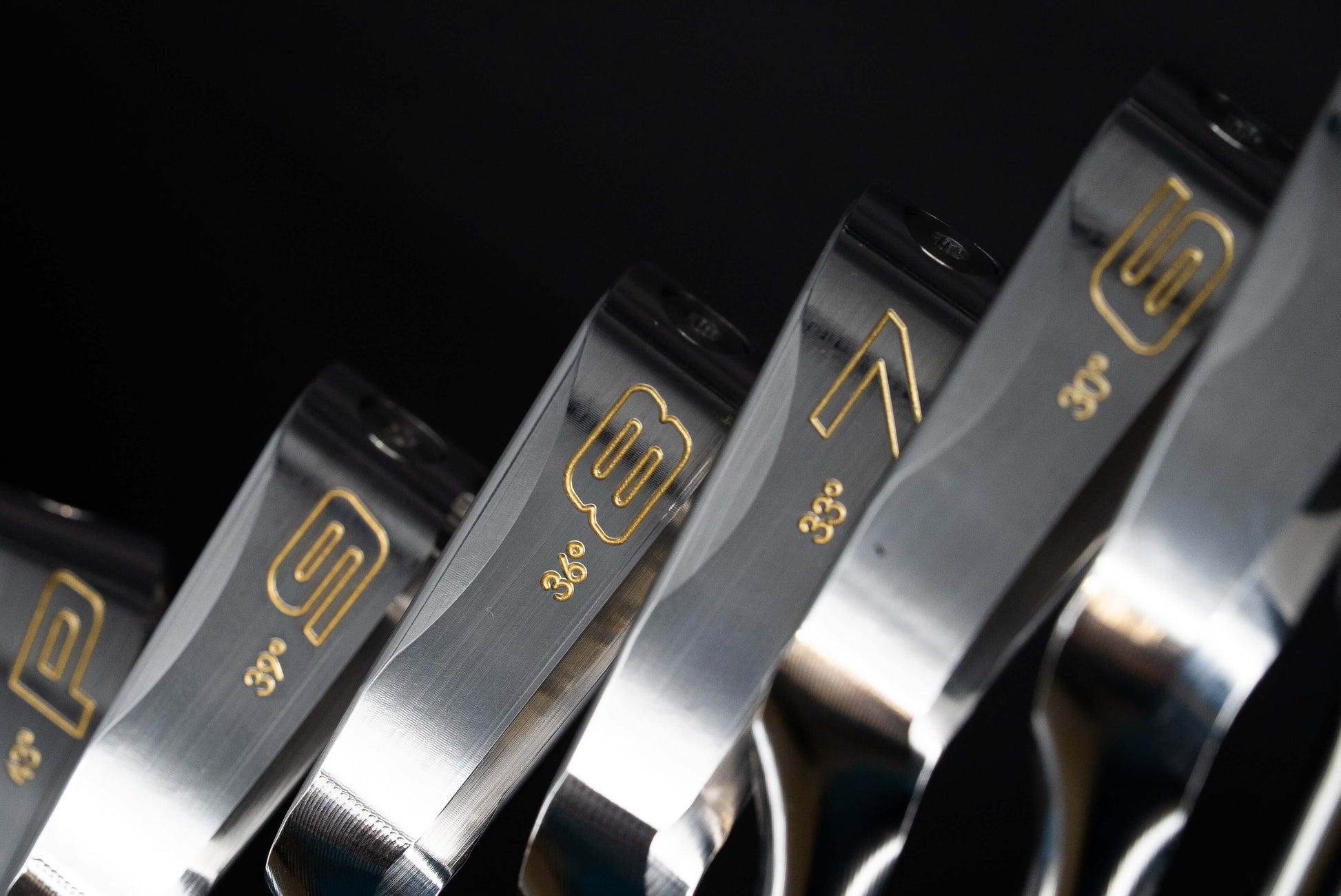 Fabre F1 Irons Heads Only – close-up of premium golf club heads showcasing different lofts and precision details.